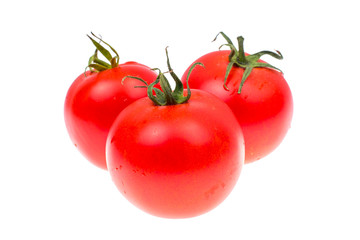 Several red ripe tomatoes isolated on white background