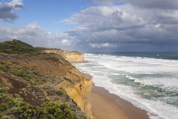 Rugged cliffs at Gibsons Steps on the Great Ocean Road. Providing access to the beach to view the Apostles Sea Rocks from the shoreline.