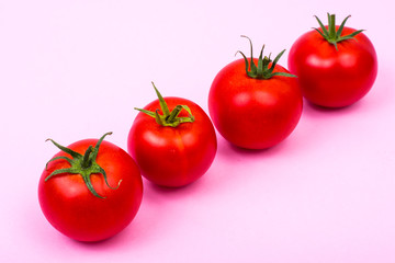 Pastel bright background with red tomatoes