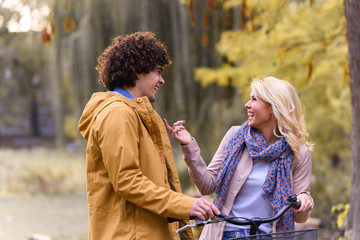 Young love couple walking in autumn park