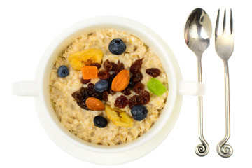 Health and Fitness food. Oatmeal porridge with berries and dried fruits