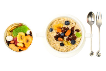 Health and Fitness food. Oatmeal porridge with berries and dried fruits