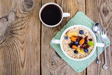 Fototapeta na wymiar Porridge from oatmeal for breakfast
