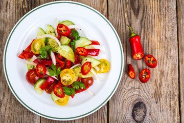 Spicy salad of fresh vegetables with chili