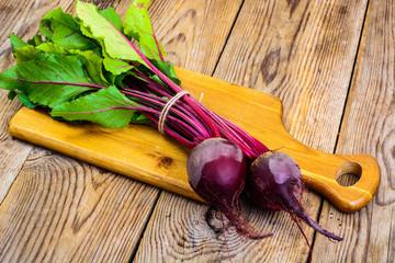 Fresh raw beetroot, sliced on kitchen cutting board