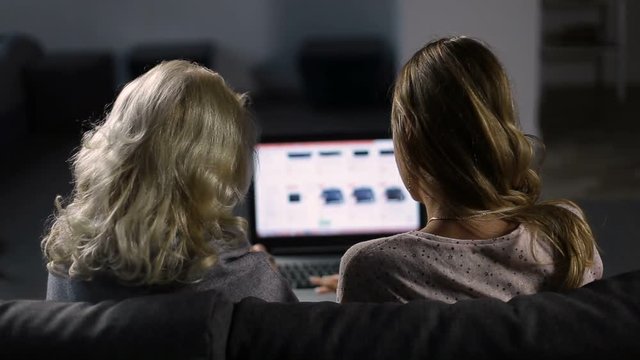 Women shoppping online on website using laptop