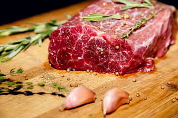 Raw beef on a cutting board.