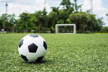 Fototapeta na wymiar football field ball on green grass , soccer field background texture