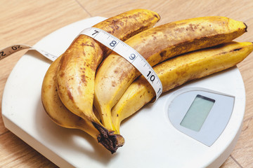 bunch of bananas lying on floor scales
