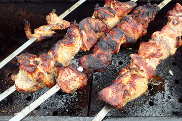 fried meat on skewers