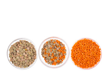 Chickpeas, orange lentils in and green, isolated on white