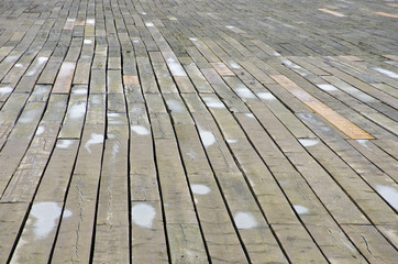 Row of wooden planks on seaside pier