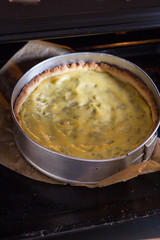 Cooking pie with rhubarb. The  cake in the form is just out of the oven.