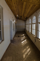 Ruins of once prosperous German mining town Kolmanskop in the Namib desert near Luderitz, Namibia, Southern Africa