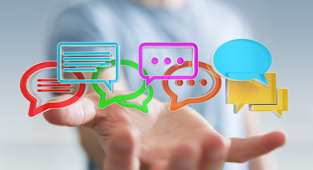 Businessman using digital colorful 3D rendering conversation icons