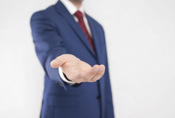Obraz premium Businessman with open hand. Holding, giving, showing concept.