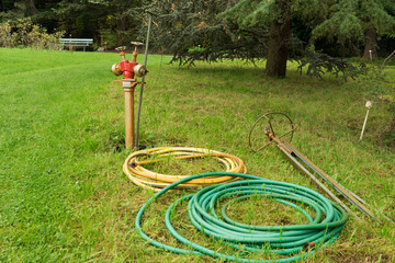 watering hose and hydrant in the garden
