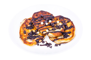 Fritters with chocolate on white plate