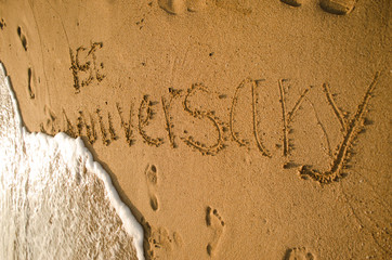First anniversary letters written on sand beach