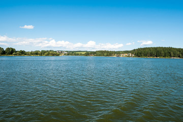 Small town or village in distance behind the lake