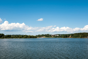 Small town or village in distance behind the lake