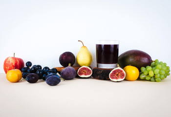 Grape juice with autumn seasonal fruits.