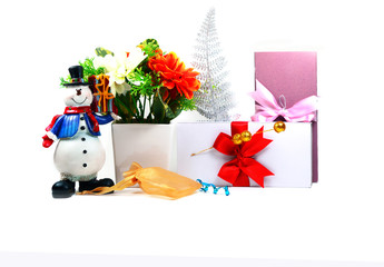 merry chrismas ,snowman doll, white vase with flowers,golden bag and gift box on white background isolated