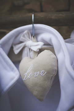 Love written in heart hanging on hanger