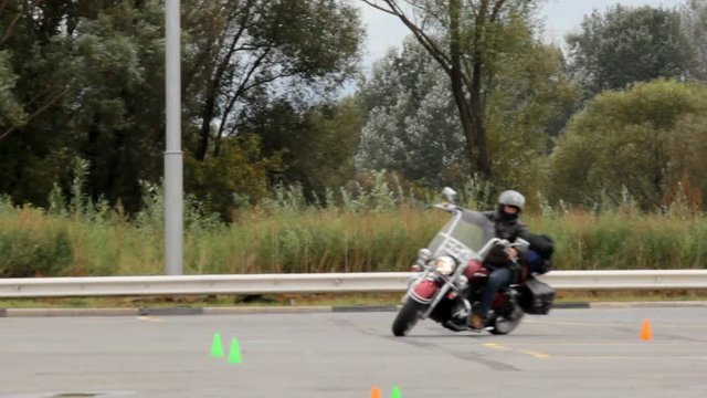 Great motorcycle maneuvering between the cones, exercise biker