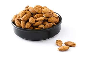 Almonds isolated in black bowl