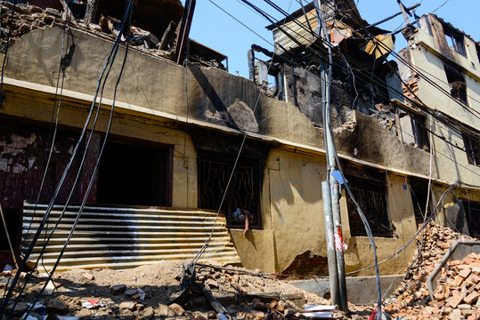 Aftermath of Nepal earthquake 2015, partially collapsed and burnt building in Kathmandu