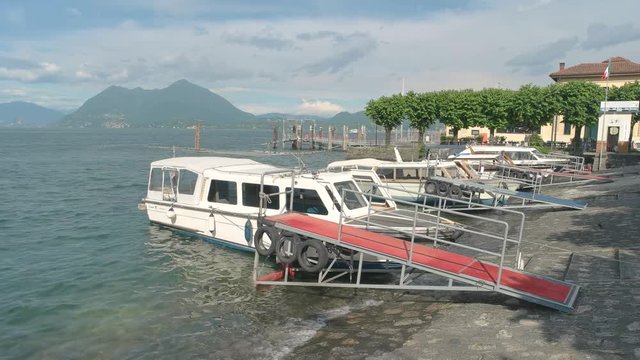 Boats on Stresa waterfront. Maggiore lake summer day.