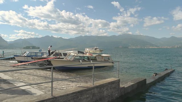 Boats shore of Maggiore lake. Beautiful summer landscape, Italy.