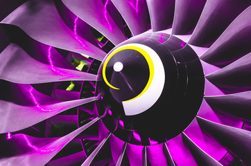 Airplane engine and blades with purple backlight Illumination close up.