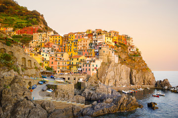 Fototapeta na wymiar Colorful and beautiful houses, village in Manarola with sunset, Cinque terre Italy famous place.