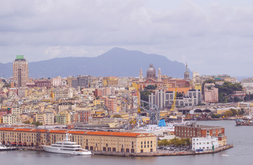 view of old port in Genoa the major Italian seaport on the Mediterranean Sea with cityscape of Genoa town.