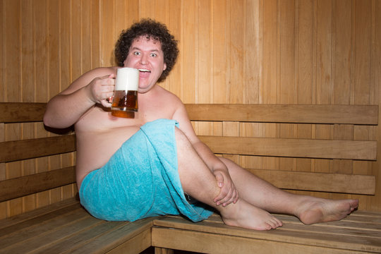 Funny Fat Man In A Sauna With A Beer. 