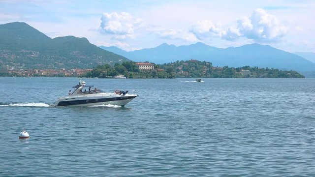 People on boat lake Maggiore. Summer in Italy, picturesque view.