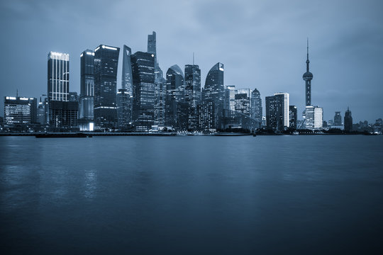 Shanghai skyline at night, China, blue tone.