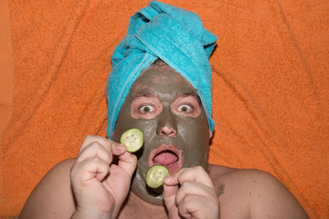 Spa and facials. Funny fat man and clay mask.