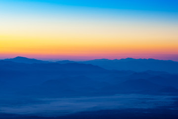 Beautiful silhouette mountains sunrise at Doi Inthanon National Park. Chiang Mai, Thailand.