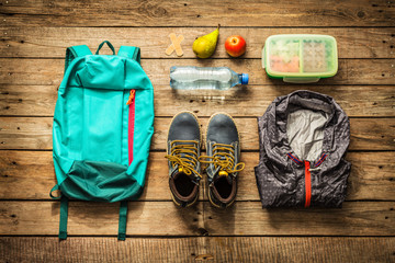 Traveling - packing (preparing) for adventure trip concept