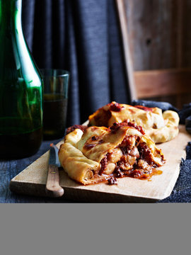 Octopus calzone on serving board