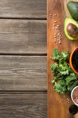 Vegetable with avocado and rock salt on cutting board