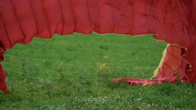 Paraglider red wing at sunny day