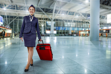 woman with red suitcase on airport 