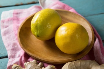 Close up of lemon in wooden plate