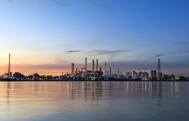 oil refinery along the river at sunrise