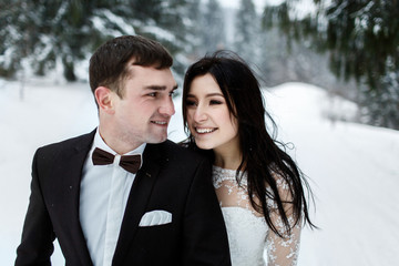 Wedding winter, bride and groom walking at winter wedding day