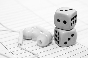 Gambling dices and headphones